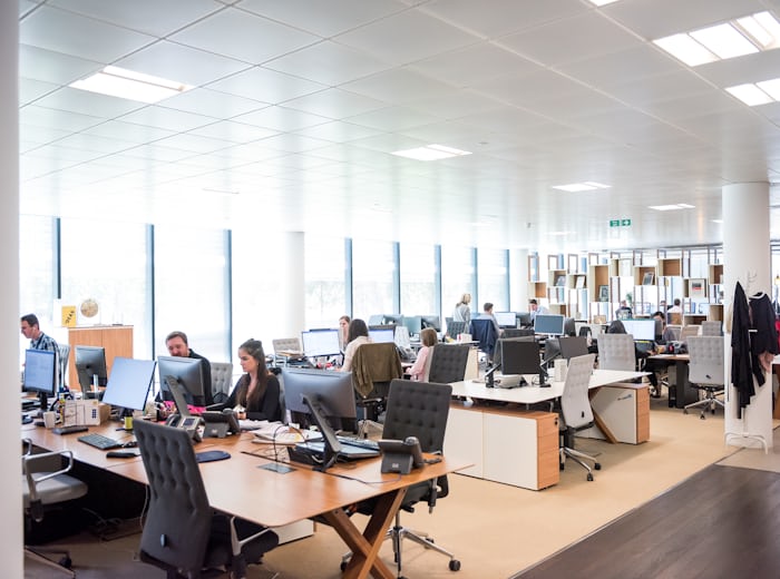 Open-plan office where telephone interpreters take incoming calls