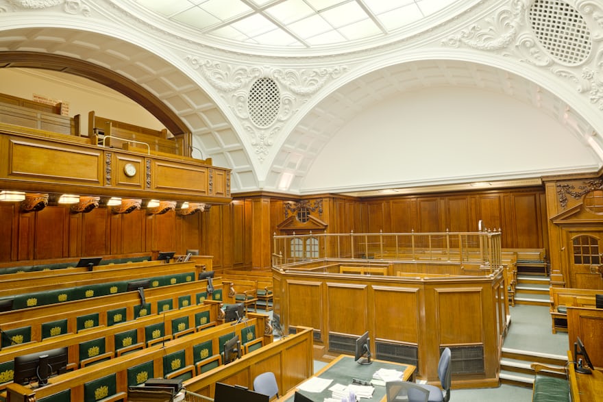 Empty courtroom where a sworn interpreter ensures accurate legal communication