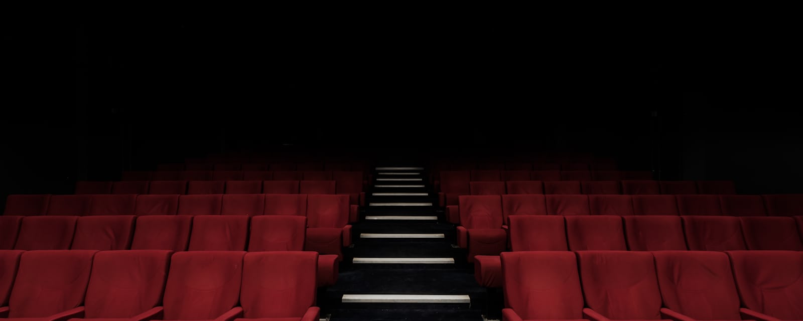 Audience watching translated audiovisual content in a cinema