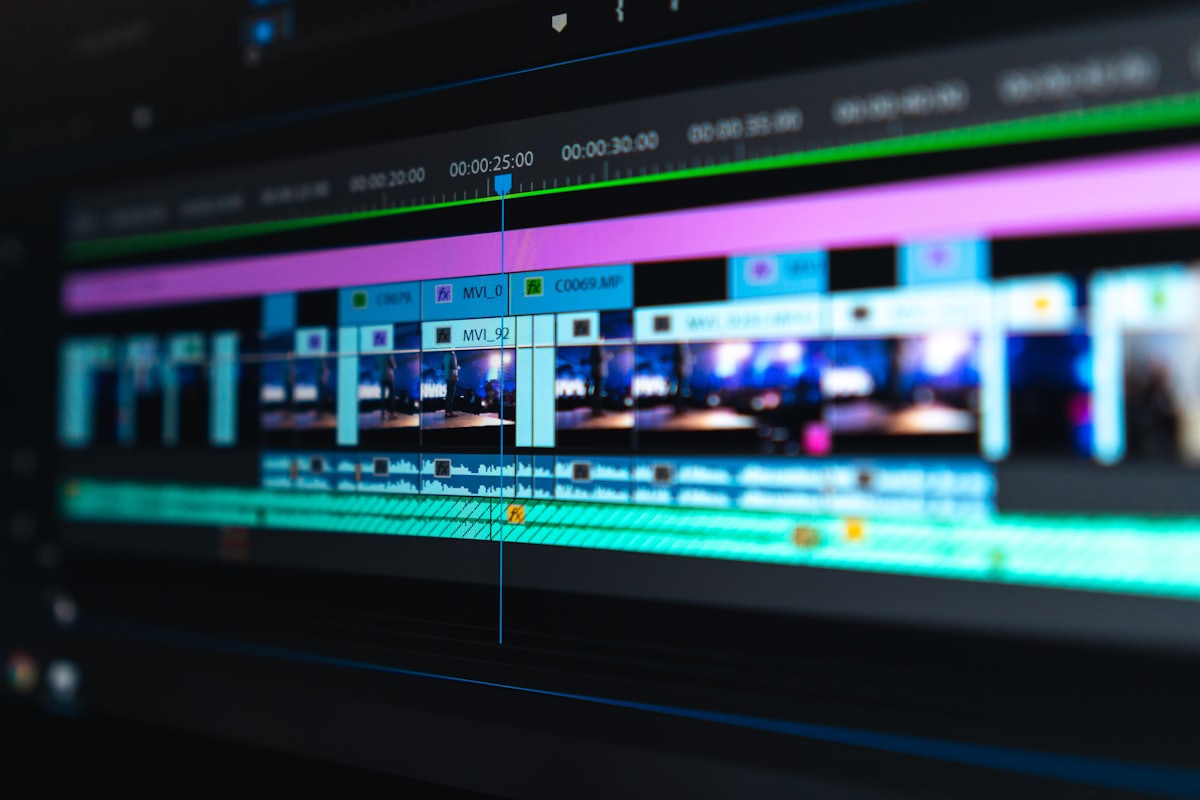 Laptop showing a video editing timeline with captions