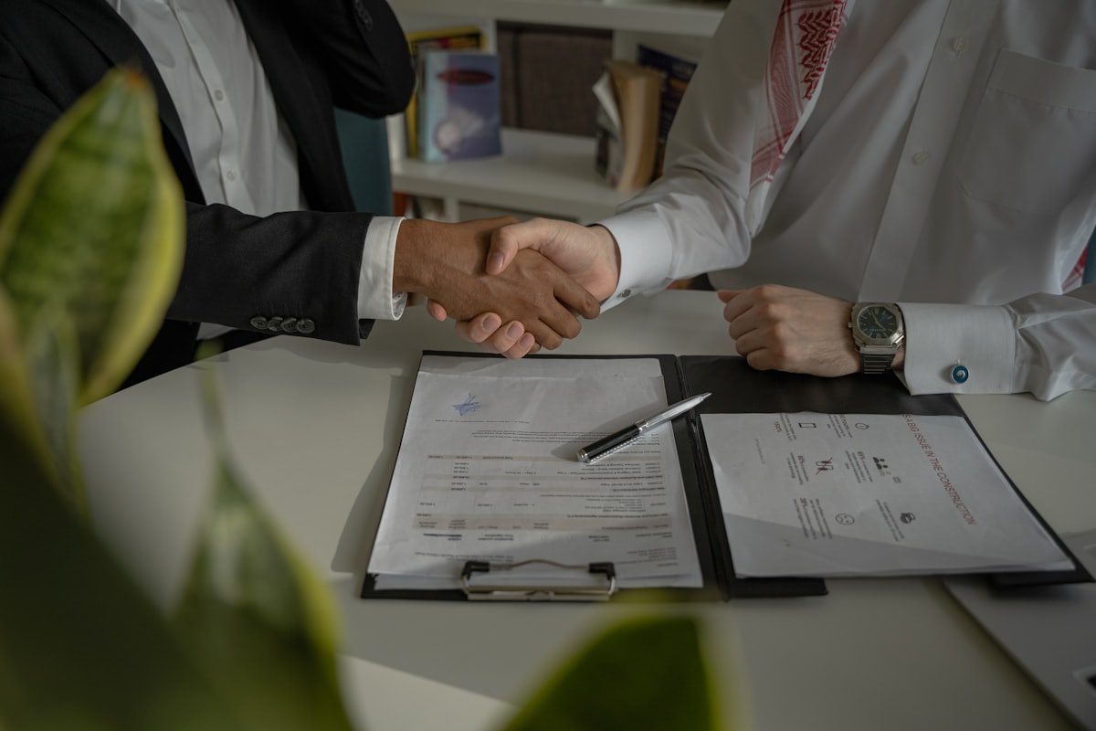 Business negotiation concluding successfully through an interpreter