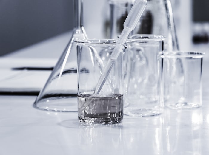 Laboratory glassware representing scientific translation work