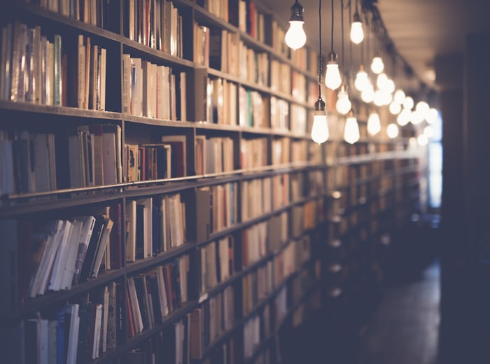University library shelves holding academic research volumes